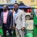 NEEV Liberia officials pose beside one of their newly launched electric tricycles in Monrovia, part of the company’s e-mobility drive toward sustainable transportation.
