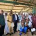 Representative Romeo Quioh (standing third from the left) poses for a picture with an African Finch Logging Limited executive, and townspeople of Numopoh. Picture credit: Anonymous