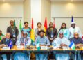 West African transport ministers and delegates pose during a high-level meeting in Abidjan, Ivory Coast, to discuss the establishment of a regional BAG States Airline.