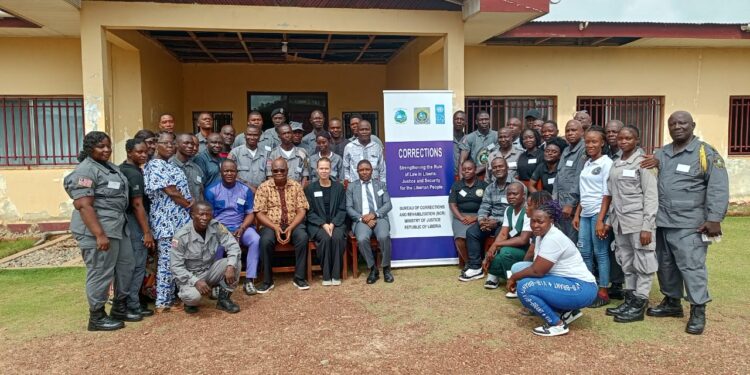 Group photo of Liberian corrections officers, trainers, and civil society representatives during the Ministry of Justice’s middle-level management training workshop at the Gbarnga Regional Hub, May 26, 2025.