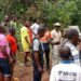 Local residents, mining company workers, and officials gather in Gbakonai, Bong County, during a government-led community engagement to address a mining license dispute between H&K Mining and Da-Tahn Company.