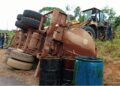 Overturned palm oil tanker with oil drums on the roadside near Harper, Maryland County, Liberia, following a crash on the Harper-Pleebo Highway