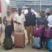 Seven repatriated Liberians and government officials arrive at Roberts International Airport after being rescued from trafficking in Myanmar