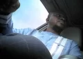 Undercover image of Amara Dukuly, a Liberian-born U.S. immigration officer, inside a vehicle during a sting operation related to a $20,000 federal bribery investigation.