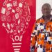 AITB Director General Abraham Billy stands beside a red vocational education-themed backdrop reaffirming the bureau’s commitment to Liberia’s TVET sector.