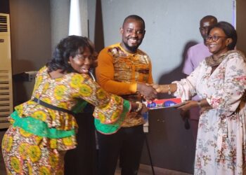 ActionAid Liberia officials and civil society leaders present a joint communiqué to a government representative, calling for reforms in public resource governance and inclusive financing