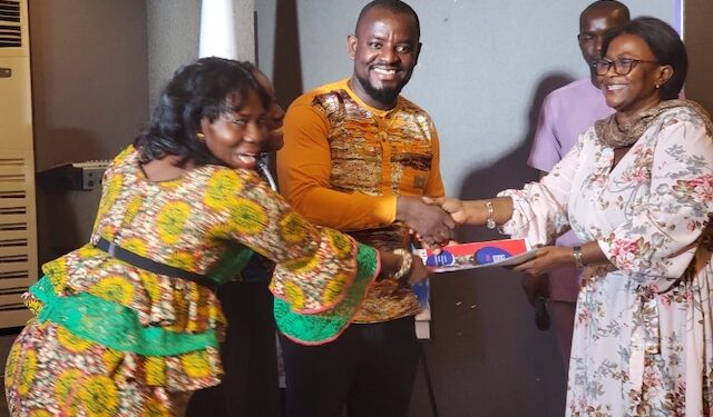 ActionAid Liberia officials and civil society leaders present a joint communiqué to a government representative, calling for reforms in public resource governance and inclusive financing