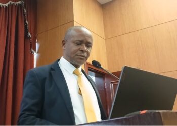NIR Executive Director Andrews Peter delivering remarks to Liberia’s House of Representatives amid backlash over the biometric national ID program's delays and costs.