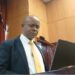 NIR Executive Director Andrews Peter delivering remarks to Liberia’s House of Representatives amid backlash over the biometric national ID program's delays and costs.