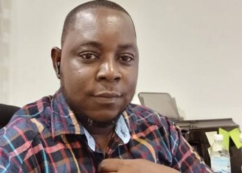 Augustine Tamba, former president of the Federation of Liberian Youth and executive director of LEOG, photographed at his office prior to his passing.