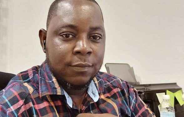 Augustine Tamba, former president of the Federation of Liberian Youth and executive director of LEOG, photographed at his office prior to his passing.