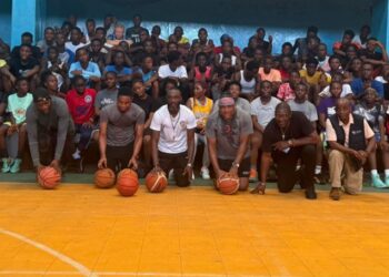 Group photo of participants and coaches at the Sweat Equity two-day basketball camp in Monrovia, held at the YMCA gymnasium with over 100 young athletes in attendance.