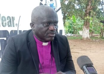 Bishop Kortu Brown addresses the media, criticizing the Liberian government’s timing of opposition lawmakers’ arrests during a national celebration