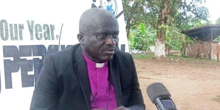 Bishop Kortu Brown addresses the media, criticizing the Liberian government’s timing of opposition lawmakers’ arrests during a national celebration