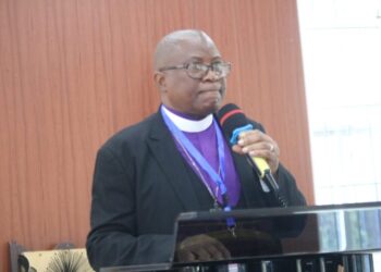 Bishop Samuel J. Quire Jr. of the United Methodist Church in Liberia addresses the congregation, condemning the Ganta Hospital attack and mourning lives lost in Nigeria.