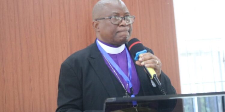 Bishop Samuel J. Quire Jr. of the United Methodist Church in Liberia addresses the congregation, condemning the Ganta Hospital attack and mourning lives lost in Nigeria.