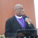 Bishop Samuel J. Quire Jr. of the United Methodist Church in Liberia addresses the congregation, condemning the Ganta Hospital attack and mourning lives lost in Nigeria.