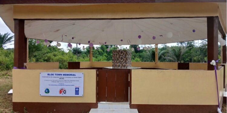 The Bloe Town Memorial in River Cess County, Liberia, built to honor the victims of the 1994 massacre by NPFL forces. The site marks a mass grave and is part of Liberia’s national effort to memorialize civil war atrocities.