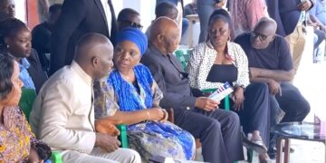 President Joseph Boakai and Foreign Minister Sara Beysolow Nyanti sit with the Doe family during a condolence visit in Monrovia ahead of the planned joint burial in Zwedru.