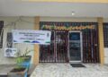Front view of the Liberia Chamber of Commerce building in Monrovia with a banner announcing the launch of the National Identification Registry Enrollment Center.