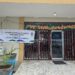 Front view of the Liberia Chamber of Commerce building in Monrovia with a banner announcing the launch of the National Identification Registry Enrollment Center.