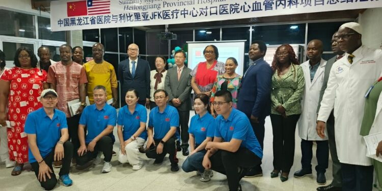 Chinese and Liberian medical officials pose together during the dedication of Liberia’s first cardiology unit at JFK Medical Center, donated by China’s Heilongjiang Provincial Hospital.