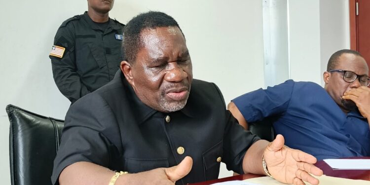 Liberia’s Labor Minister Cooper W. Kruah Sr. speaking during a press conference as he faces scrutiny over unauthorized work permit waivers to Chinese workers.