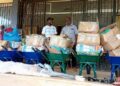 Stacks of sanitation materials including wheelbarrows and boxes donated by Conservation International to Harper City Corporation, Liberia.