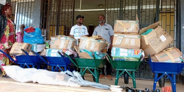Stacks of sanitation materials including wheelbarrows and boxes donated by Conservation International to Harper City Corporation, Liberia.