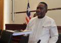 Labor Minister Cllr. Cooper W. Kruah presents a detailed report to the Liberian Senate defending over 10,000 work permits issued in 2024.