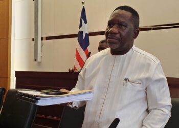 Labor Minister Cllr. Cooper W. Kruah presents a detailed report to the Liberian Senate defending over 10,000 work permits issued in 2024.