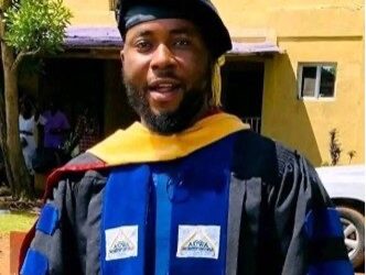 Dr. Isaac P. Podah, president of Lofa County University, in academic regalia amid growing calls for his suspension during a corruption investigation.