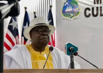 NCHE Executive Director Edward Lama Wonkeryor addresses reporters at the Ministry of Information in Monrovia during the announcement of Liberia’s college shutdowns and suspensions