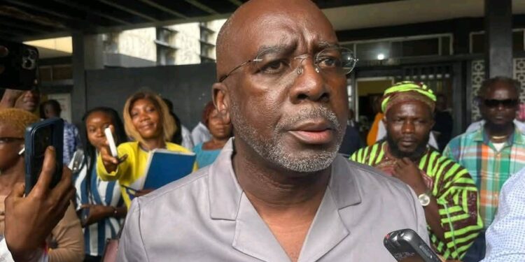 former speaker Cllr. J. Fonati Koffa addresses journalists outside court following bail bond proceedings involving former Speaker J. Fonati Koffa and other lawmakers accused in the Capitol arson case
