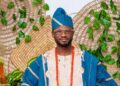 Fred Ola, founder of Big Brabee Liberia, dressed in traditional Nigerian attire, amid calls for the return of Liberia’s pioneering reality TV show