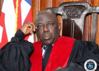 Associate Justice Yamie Quiqui Gbeisay nominated by President Joseph Boakai as Liberia’s new Chief Justice, seated in court with robe and national flag