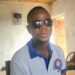 George Harmon, a Liberian worker in Kakata, wears protective sunglasses after suffering cement burns allegedly caused by his Syrian supervisor at a World Bank-funded construction site