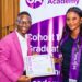 Gonet Academy Founder and CEO Mohamed Kerkula presents a professional certificate in Monitoring and Evaluation to a female graduate during Cohort 11 graduation ceremony