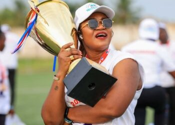Determine Girls FC President Grace Hawa Weah celebrates with a championship trophy after the LFA lifted her suspension and imposed revised sanctions.