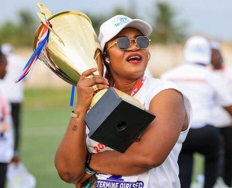 Determine Girls FC President Grace Hawa Weah celebrates with a championship trophy after the LFA lifted her suspension and imposed revised sanctions.