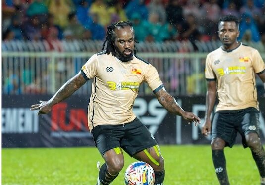 Francis “Grandpa” Doe controls the ball during a friendly match for Ex-Selangor in Malaysia, June 2025.
