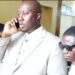 Al Hussein Fadiga, seen on the phone while being escorted by court officers, after his arrest and remand at Monrovia Central Prison on June 23, 2025, over a $1.6 million libel judgment.