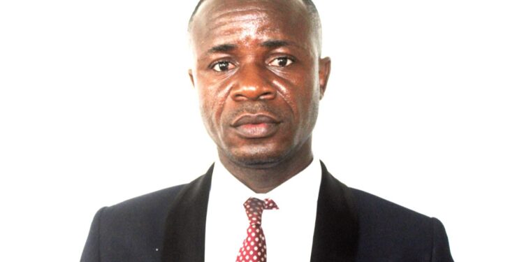 ortrait of Isaac T.Z. Montgomery, former Secretary-General of the Liberia Football Association, dressed in a dark suit and red tie, responding to an ongoing LACC corruption probe.