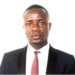 ortrait of Isaac T.Z. Montgomery, former Secretary-General of the Liberia Football Association, dressed in a dark suit and red tie, responding to an ongoing LACC corruption probe.