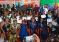 Graduates of Ambassador Kemayah’s Women Empowerment & Vocational Skills Training Program pose with certificates in Monrovia