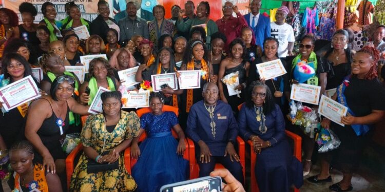 Graduates of Ambassador Kemayah’s Women Empowerment & Vocational Skills Training Program pose with certificates in Monrovia
