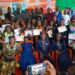 Graduates of Ambassador Kemayah’s Women Empowerment & Vocational Skills Training Program pose with certificates in Monrovia