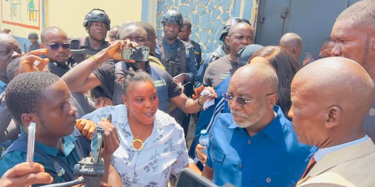 Former Speaker J. Fonati Koffa emerges from Monrovia Central Prison surrounded by supporters and security after posting a US$440,000 bond in the Capitol fire case
