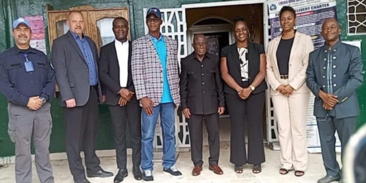 LDEA officials and U.S. DEA delegation pose for a group photo in front of LDEA headquarters in Monrovia after discussions on strengthening anti-narcotics cooperation.