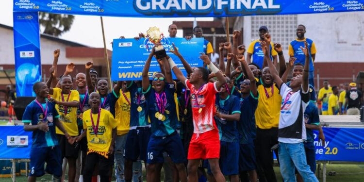 New Kru Town U-17 team celebrates with the trophy after winning the 2025 Lonestar Cell MTN MoMo Community League final in Monrovia.